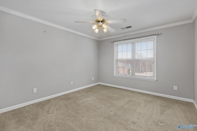 spare room with ceiling fan, light colored carpet, and ornamental molding