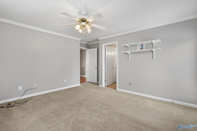 unfurnished bedroom featuring crown molding, ceiling fan, and light carpet