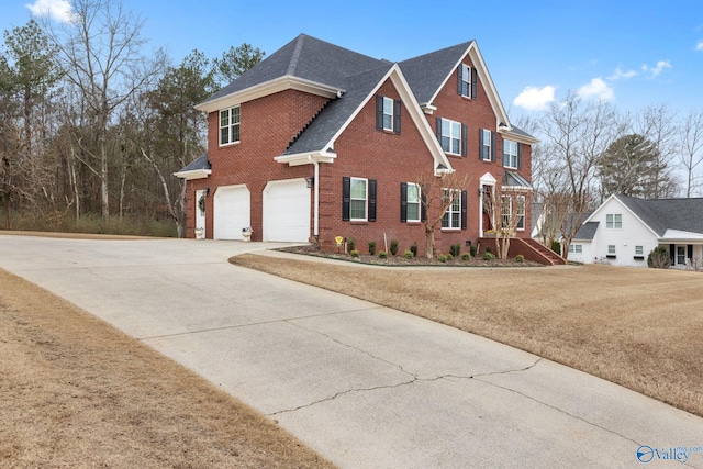 view of front of home featuring a garage and a front yard