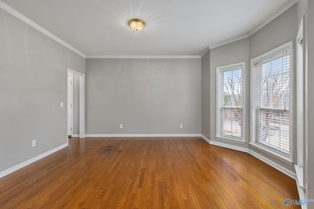 unfurnished room featuring ornamental molding and hardwood / wood-style floors