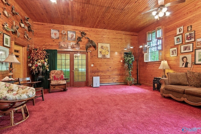 carpeted living area with wood walls, a ceiling fan, wood ceiling, and a baseboard radiator