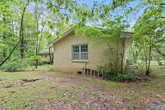view of home's exterior featuring brick siding