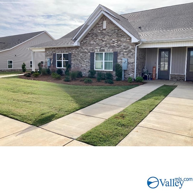 view of front of home with a front yard