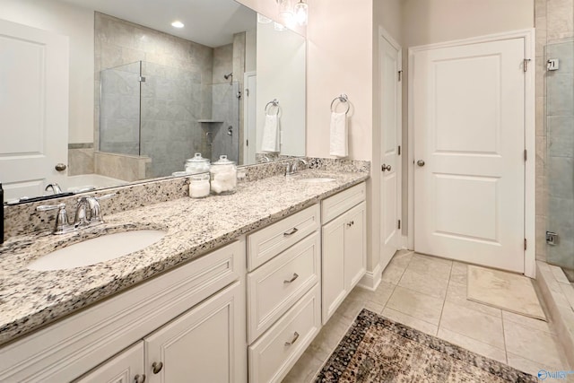 bathroom featuring vanity, tile patterned flooring, and plus walk in shower