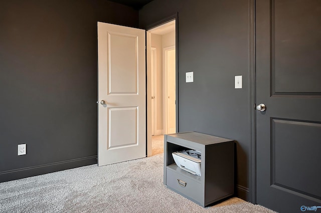 unfurnished bedroom with light carpet