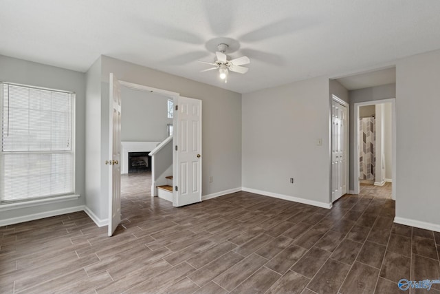 unfurnished room with ceiling fan