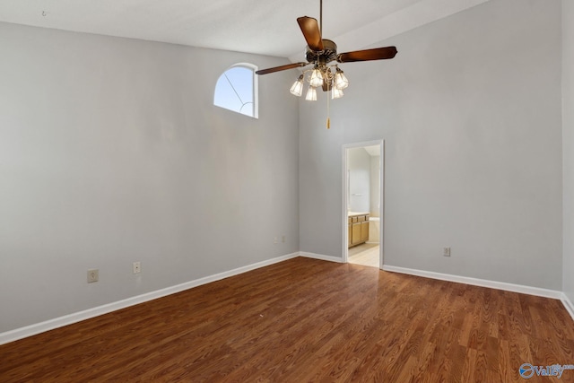 spare room with ceiling fan and wood-type flooring