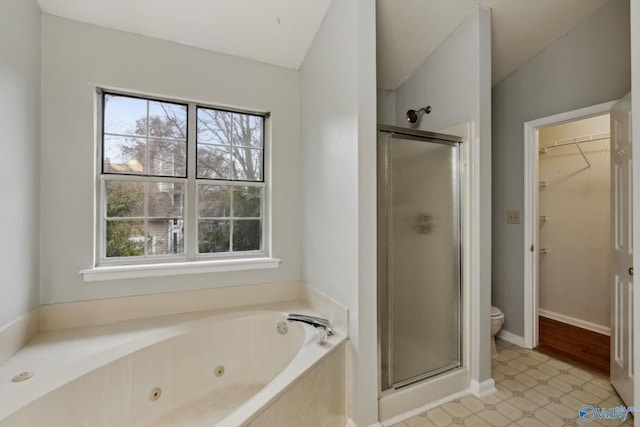 bathroom featuring shower with separate bathtub, vaulted ceiling, and toilet