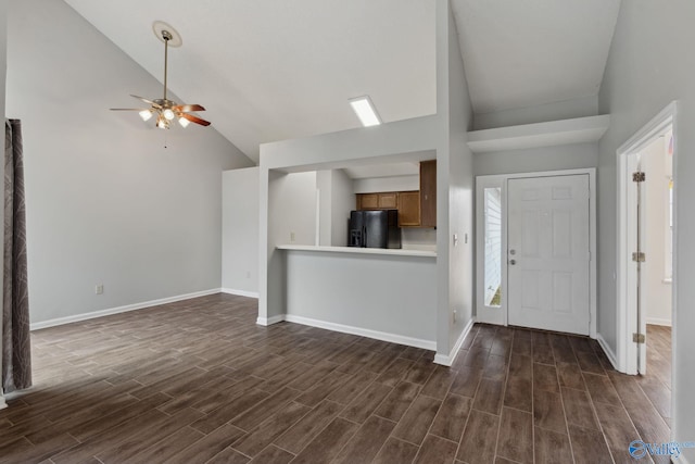 entrance foyer featuring high vaulted ceiling and ceiling fan