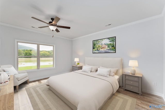 189 Saddle St, New Market, AL 35761 - bedroom with crown molding, light wood-type flooring, a ceiling fan, and a water view