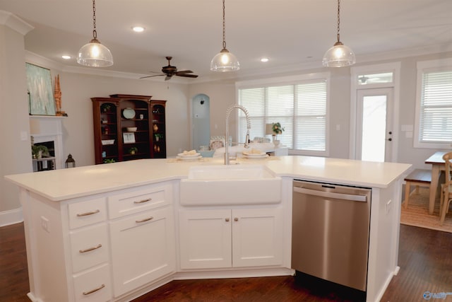 kitchen with sink, white cabinetry, dishwasher, pendant lighting, and a kitchen island with sink