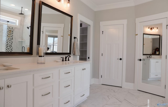 bathroom with vanity, plenty of natural light, ornamental molding, and walk in shower