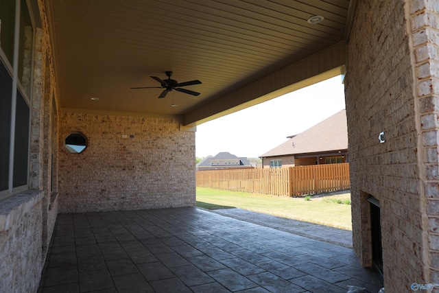 view of patio featuring ceiling fan