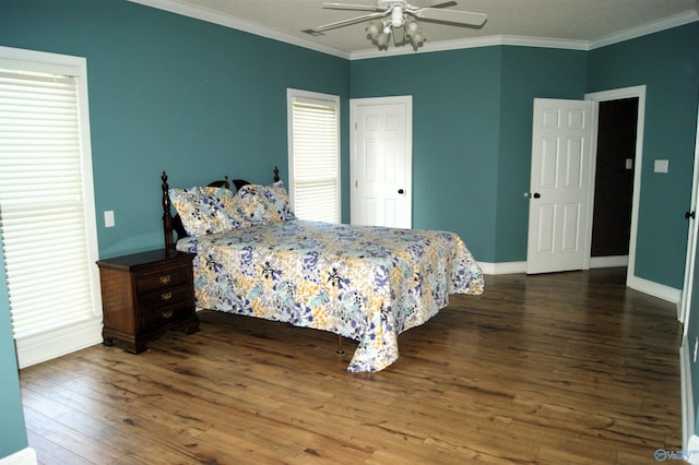 bedroom with ceiling fan, wood finished floors, baseboards, and ornamental molding