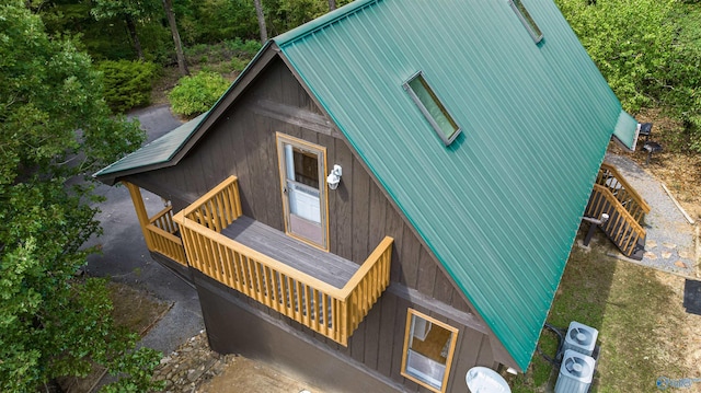 exterior space featuring a balcony and central AC unit