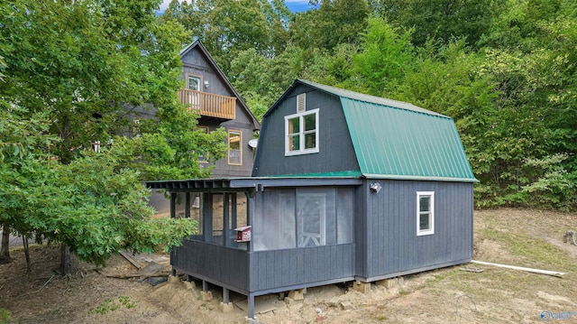 view of property exterior featuring an outbuilding