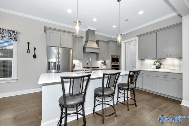 kitchen featuring appliances with stainless steel finishes, premium range hood, backsplash, and dark wood-type flooring