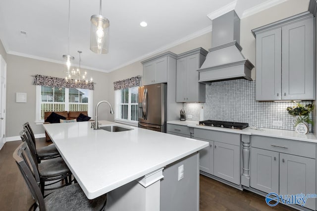 kitchen featuring custom exhaust hood, tasteful backsplash, sink, dark hardwood / wood-style floors, and appliances with stainless steel finishes