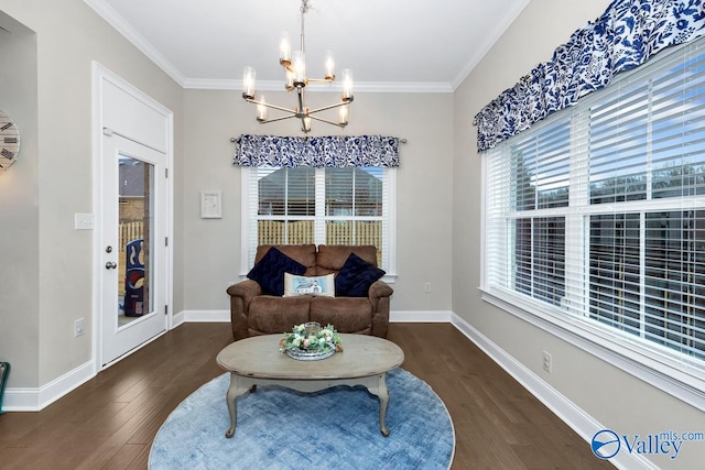 living area with dark hardwood / wood-style flooring, a wealth of natural light, and ornamental molding