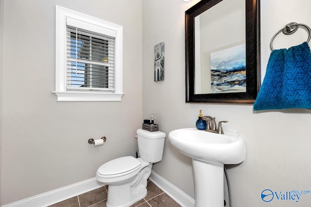 bathroom featuring tile patterned floors and toilet