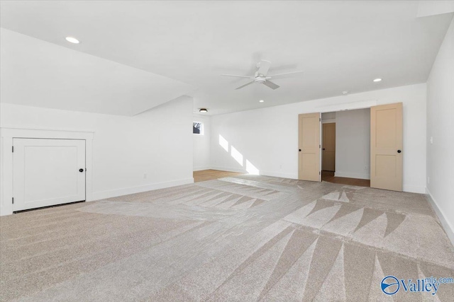 spare room featuring recessed lighting, baseboards, ceiling fan, and light colored carpet