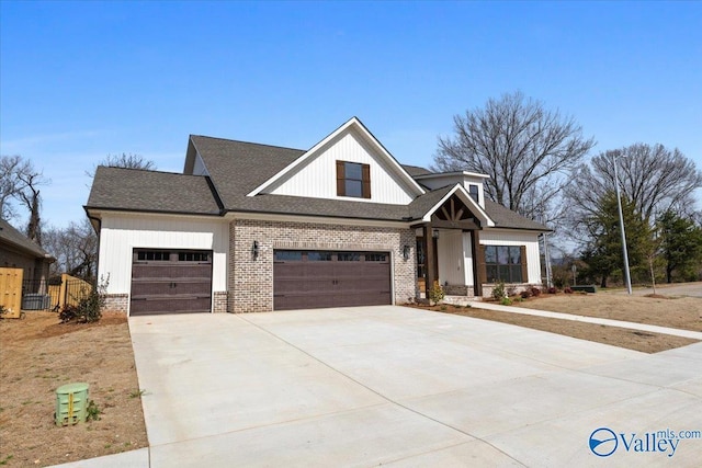 modern farmhouse style home featuring driveway, brick siding, and an attached garage