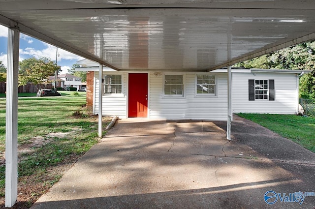 exterior space with a carport