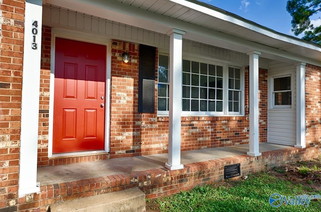 property entrance with covered porch