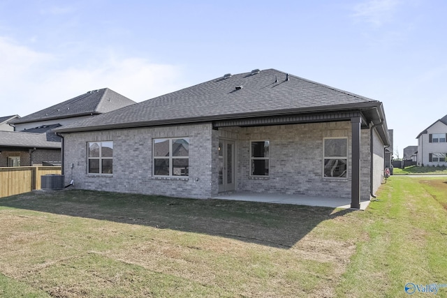 412 Tracer St, Huntsville, AL 35811 - back of house featuring a yard, fence, a shingled roof, and a patio