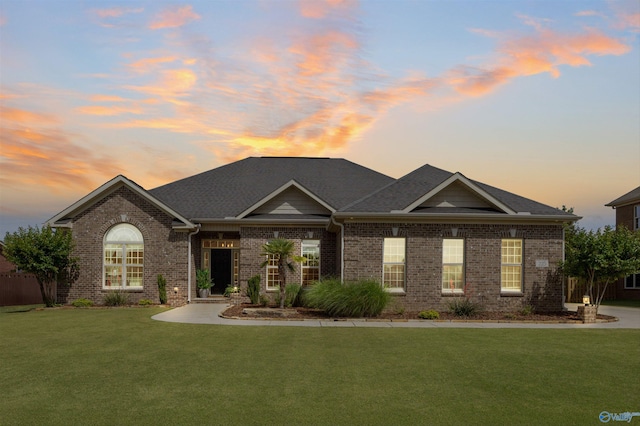 225 Nettles Dr NW, Madison, AL 35757 - view of front facade featuring brick siding and a yard