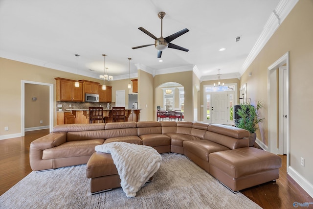 225 Nettles Dr NW, Madison, AL 35757 - living area featuring dark wood-style flooring, baseboards, recessed lighting, a ceiling fan, and arched walkways