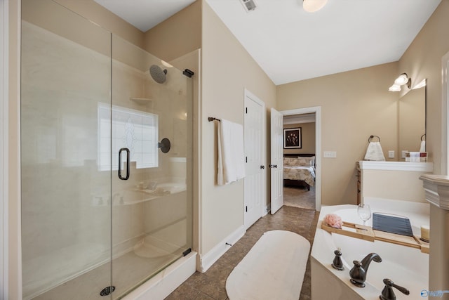 225 Nettles Dr NW, Madison, AL 35757 - bathroom with a stall shower, ensuite bathroom, tile patterned floors, and vanity