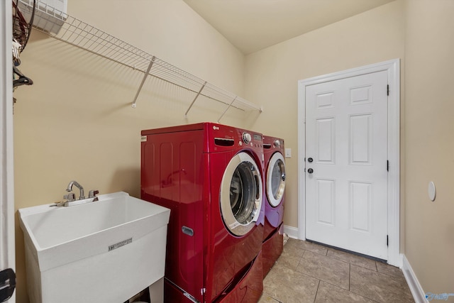 225 Nettles Dr NW, Madison, AL 35757 - washroom featuring independent washer and dryer, baseboards, and tile patterned flooring
