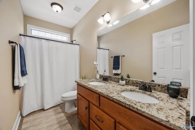 225 Nettles Dr NW, Madison, AL 35757 - full bath featuring toilet, double vanity, and a shower with curtain