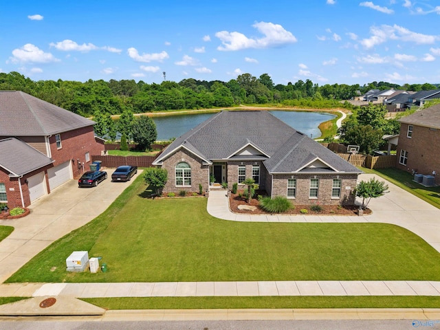 225 Nettles Dr NW, Madison, AL 35757 - view of front of home featuring concrete driveway, a water view, cooling unit, and brick siding