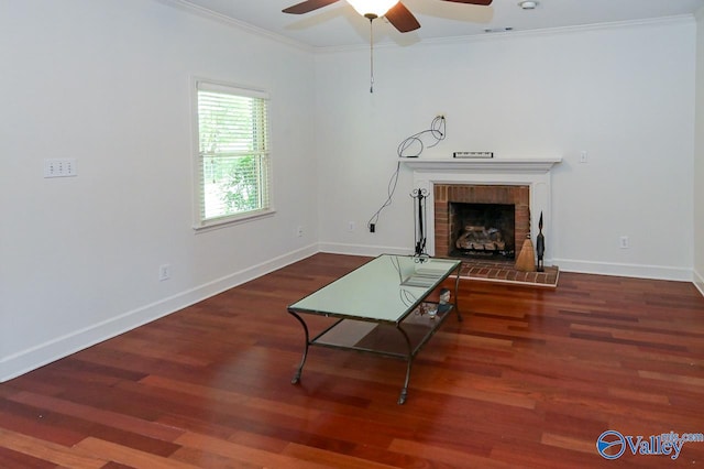 living room featuring ceiling fan, a fireplace, hardwood / wood-style flooring, and crown molding