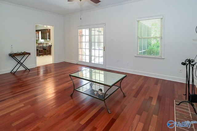 unfurnished living room with ceiling fan, hardwood / wood-style floors, and crown molding