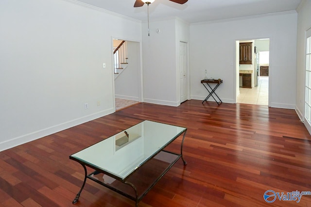 living room with ceiling fan, crown molding, and tile patterned floors