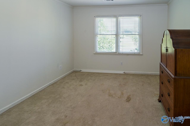 unfurnished bedroom featuring light colored carpet and crown molding