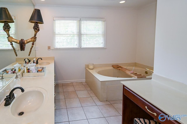 bathroom featuring ornamental molding, a tub to relax in, vanity, and tile patterned floors