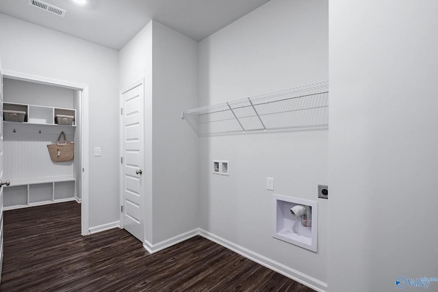 laundry area with dark hardwood / wood-style floors, washer hookup, and hookup for an electric dryer