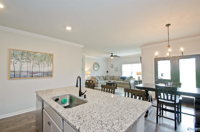 14267 Leadenhall Ln, Athens, AL 35613 - kitchen with a sink, dishwasher, crown molding, dark wood-style flooring, and hanging light fixtures