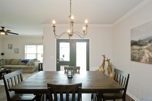 14267 Leadenhall Ln, Athens, AL 35613 - dining space with crown molding, ceiling fan, a chandelier, and wood finished floors