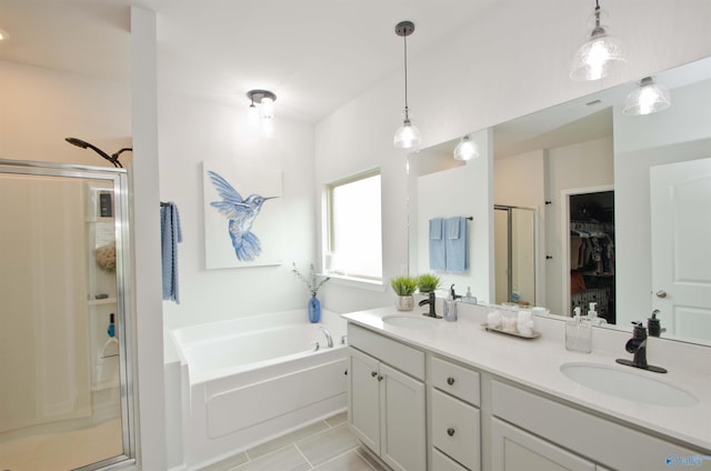 14267 Leadenhall Ln, Athens, AL 35613 - bathroom featuring a stall shower, a garden tub, double vanity, and tile patterned floors
