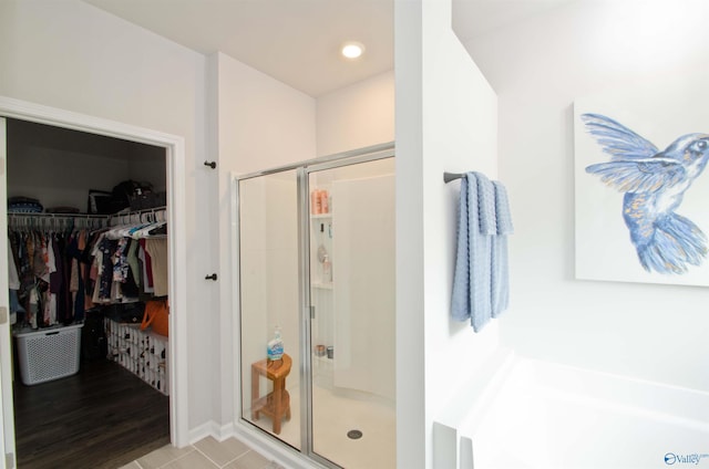 14267 Leadenhall Ln, Athens, AL 35613 - bathroom with a shower stall, a spacious closet, a garden tub, recessed lighting, and tile patterned floors