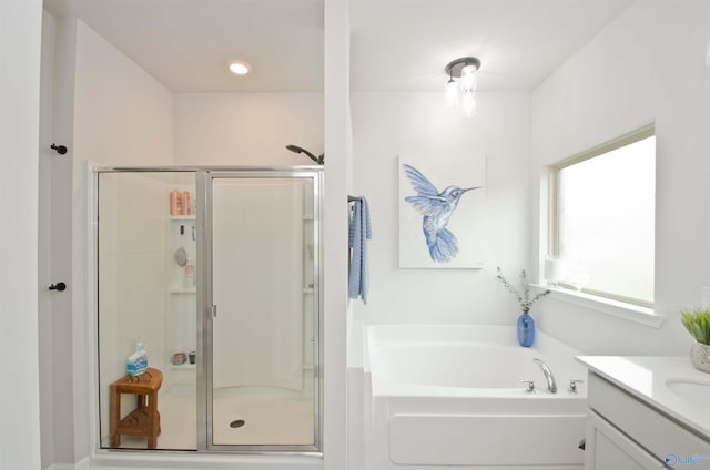14267 Leadenhall Ln, Athens, AL 35613 - full bathroom featuring a bath, a shower stall, and vanity