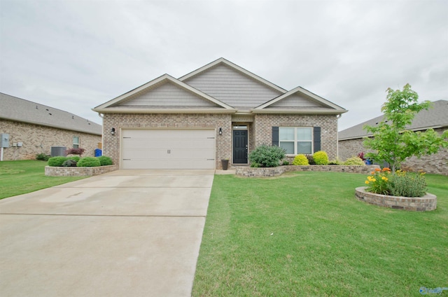 14267 Leadenhall Ln, Athens, AL 35613 - view of front of home featuring driveway, a garage, a front yard, and brick siding