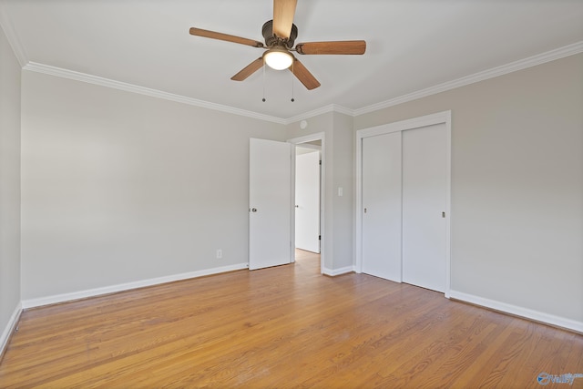 unfurnished bedroom featuring light wood-style floors and ornamental molding