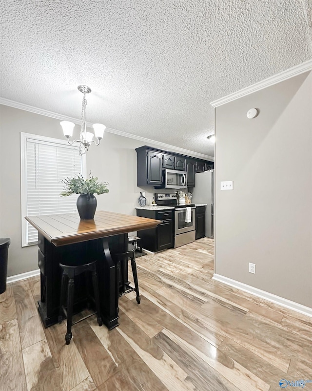 108 Mountain Home Rd, Trinity, AL 35673 - dining room featuring crown molding, a textured ceiling, a chandelier, light wood finished floors, and baseboards