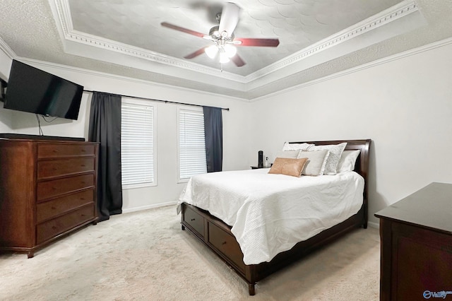 108 Mountain Home Rd, Trinity, AL 35673 - bedroom featuring a tray ceiling, light colored carpet, ornamental molding, baseboards, and a ceiling fan